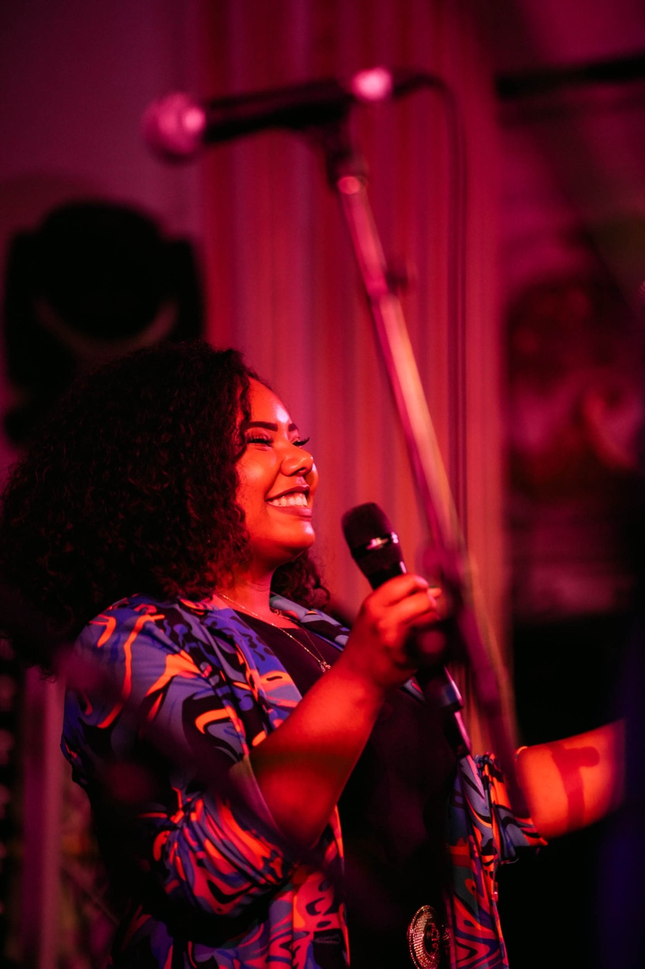 Portrait of Nicole Battick laughing while performing